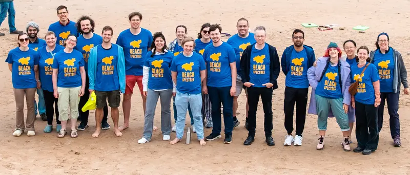 A line of people in blue Beach Spectres t-shirts, looking at the camera.